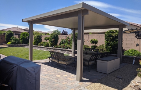 backyard-covered-patio-with-paver-floor.jpg Backyard covered patio with paver flooring and landscaped yard.