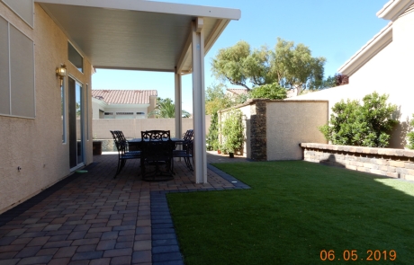 backyard-covered-patio-with-paver-flooring.jpg Backyard covered patio with custom paver flooring and artificial lawn.