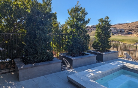backyard-pool-landscape-with-putting-green.jpg Backyard pool landscape with custom stonework and putting green.