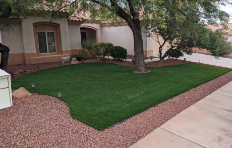 front-yard-artificial-grass-with-desert-landscaping.jpg Front yard landscape with artificial grass, decorative rocks, and mature tree.