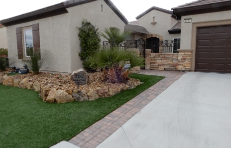 front-yard-desert-landscape-with-stone-border.jpg Front yard with desert landscaping, rock garden, and stone accent wall.