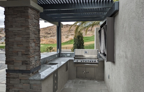 luxury-poolside-stone-terrace-with-view.jpg Luxury poolside stone terrace overlooking mountains and landscaped yard.