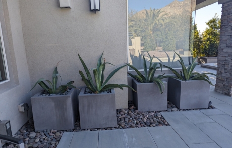 modern-firepit-stone-seating-by-pool.jpg Modern stone firepit with seating area overlooking pool and desert landscape.
