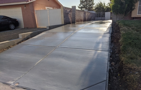 new-concrete-driveway-installation.jpg Freshly poured concrete driveway installation with smooth finish.