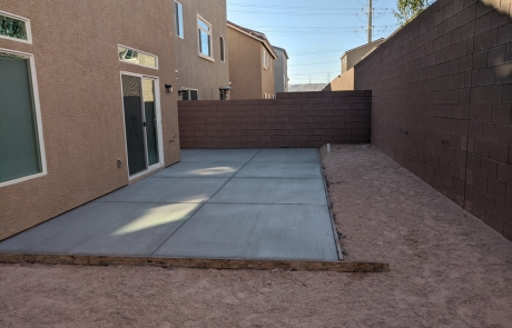 new-concrete-patio-installation.jpg Freshly poured concrete patio installation in side yard.