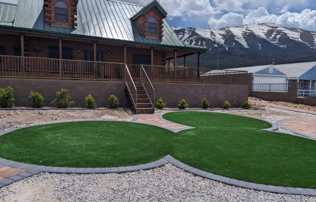 stone-patio-with-modern-seating-and-planters.jpg Stone patio with modern seating arrangement and square planters.