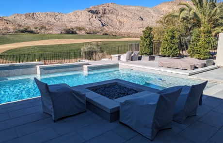 stone-planters-with-trees-by-poolside.jpg Stone planters with tall trees providing privacy next to pool.